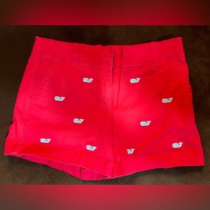 Vineyard Vines red chino shorts with all over embroidered whales.